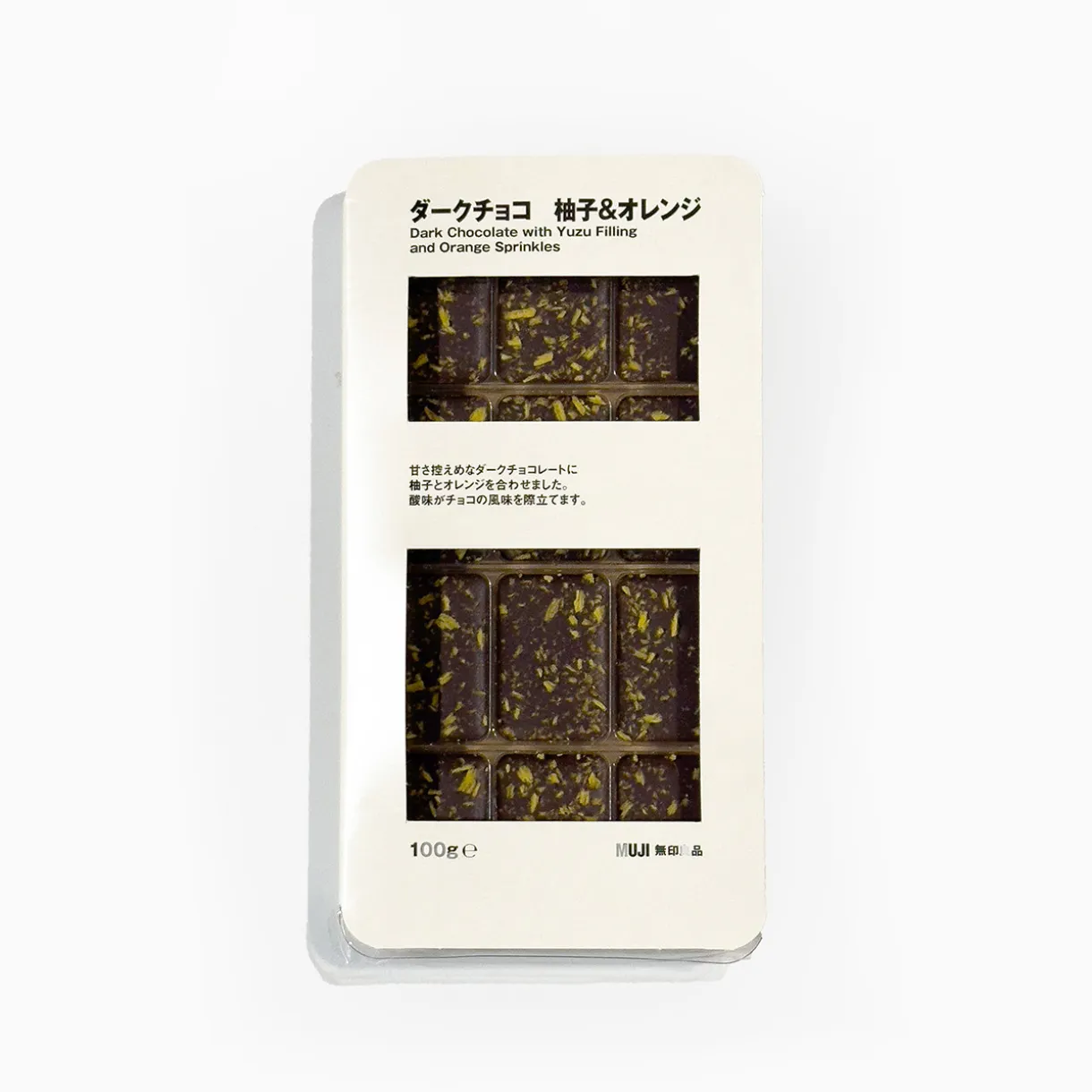 Chocolat noir fourré de yuzu et de pépites d'oranges