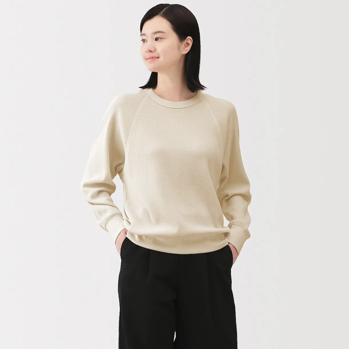 Pull à col rond en coton biologique tricoté gaufré pour femme
